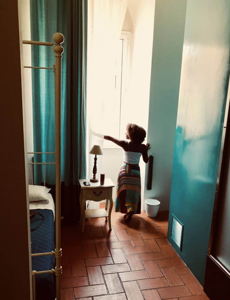 Woman in front of window in Rome