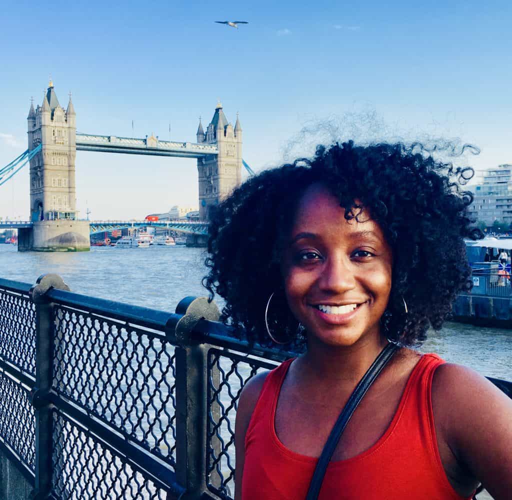 Black Woman in front of Tower of London