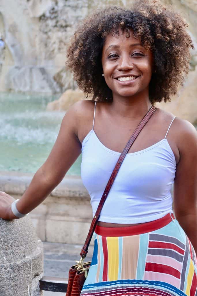 Woman in front of fountain at Piazza Navona