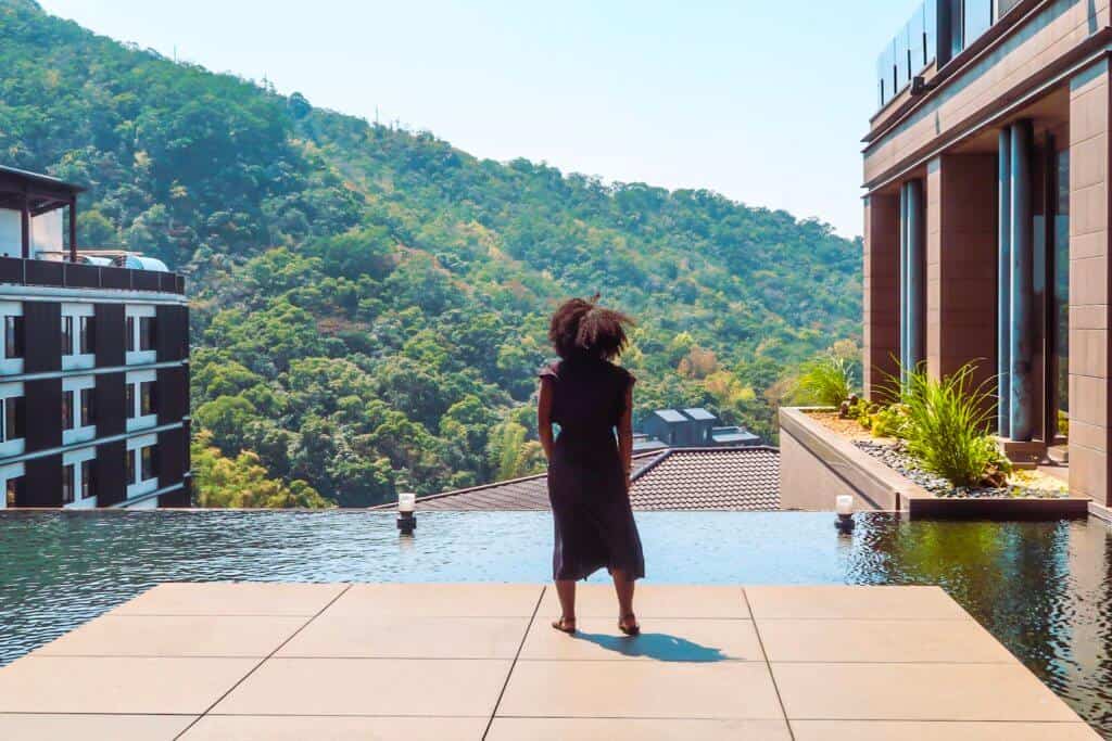 woman standing looking at mountain