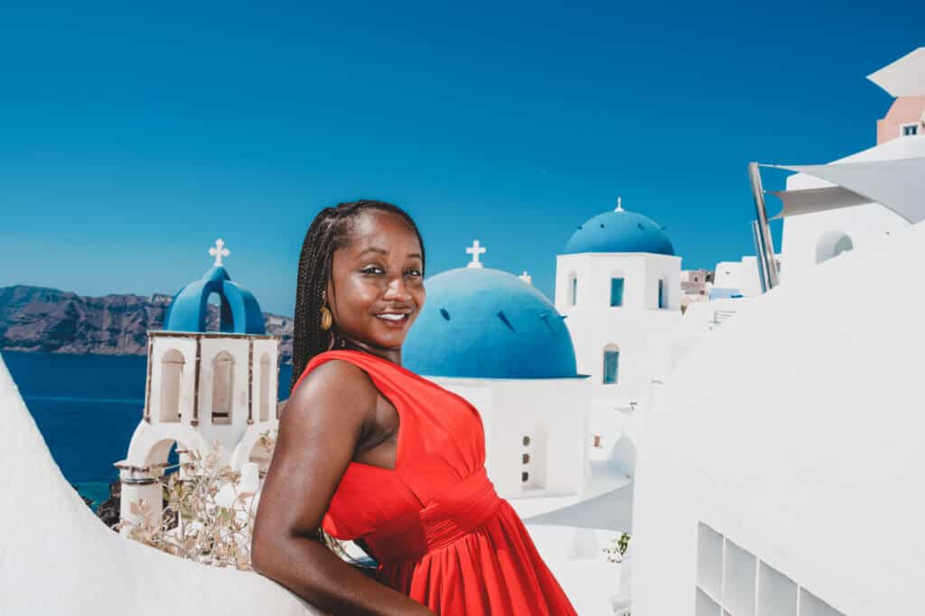 woman in red dress in Santorini 