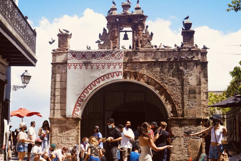 Exterior of Capilla del Santo Cristo de la Salud&nbsp;with many tourists outside of it.