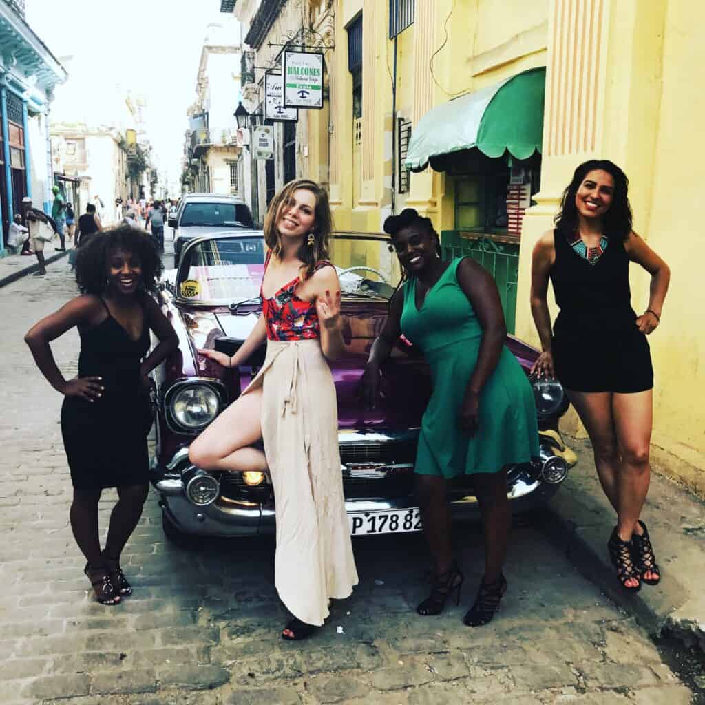 Women after classic car tour in Havana