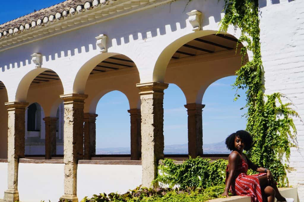 Woman sitting by Garden in the Alhambra